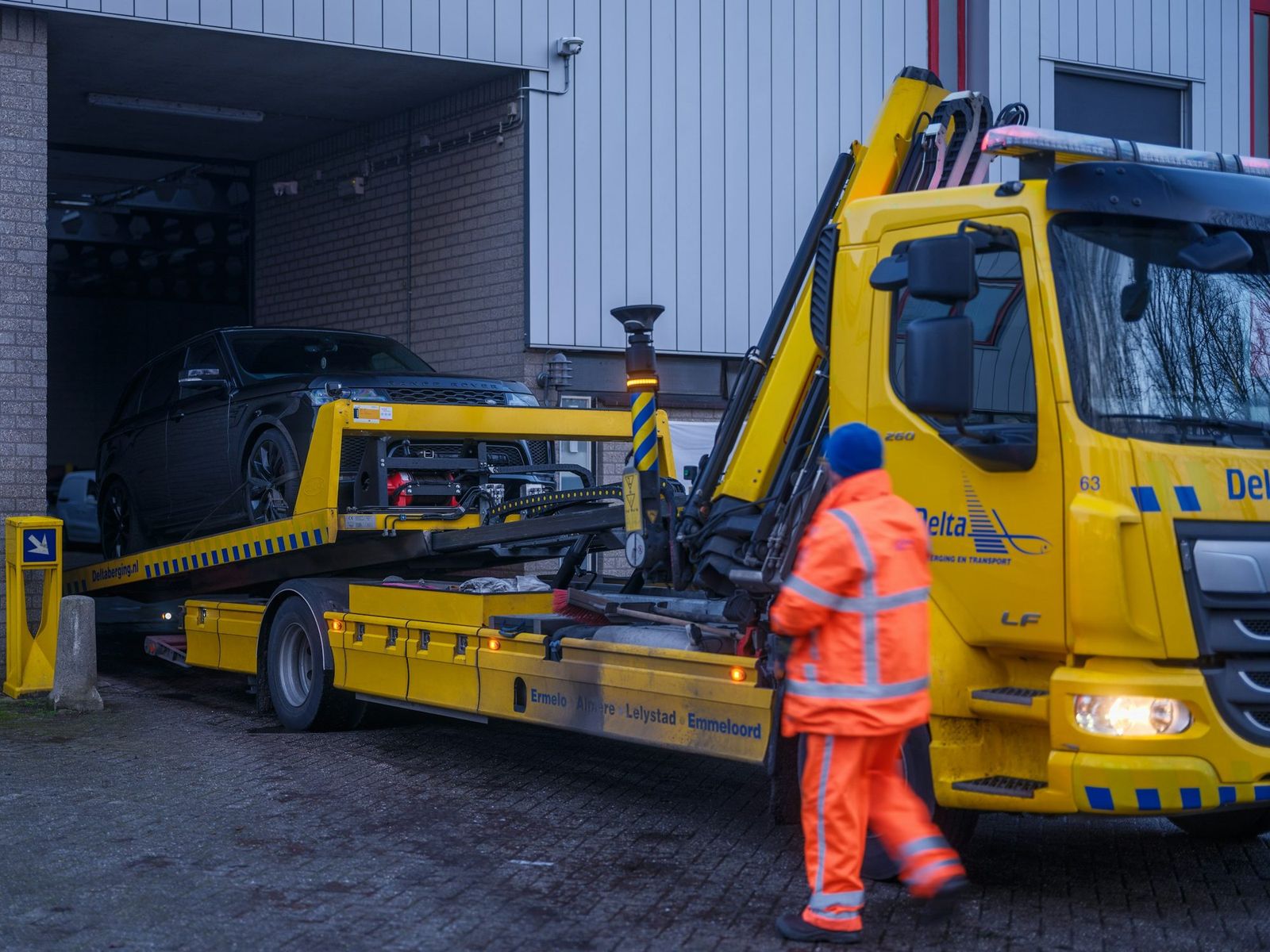 Tow operator loading a vehicle